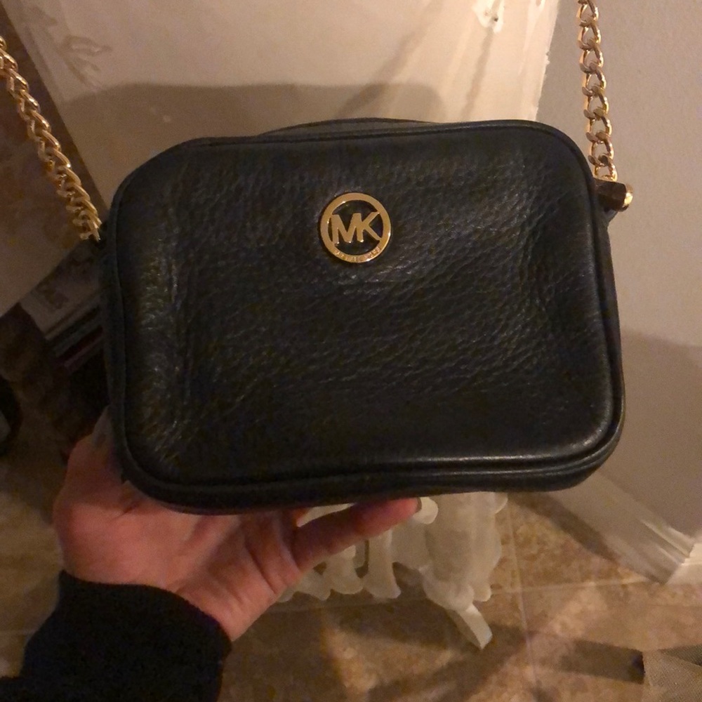 Black Michael Kors cross body purse w/ gold detail